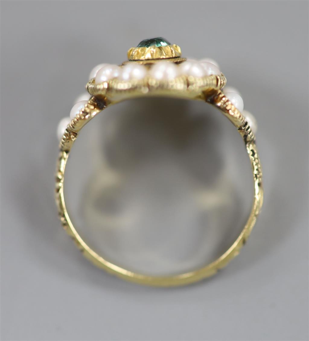 A Victorian yellow metal, split pearl and emerald? set circular cluster ring, size O, gross 4 grams.